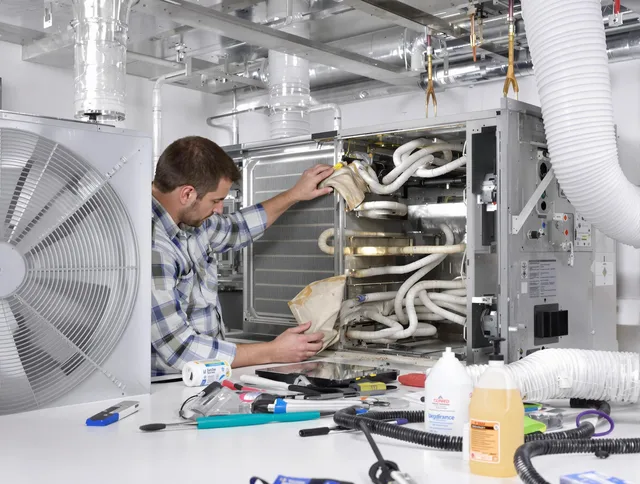 Lynnfield Air Duct Cleaning specialist performing precision AC coil cleaning in Lynnfield