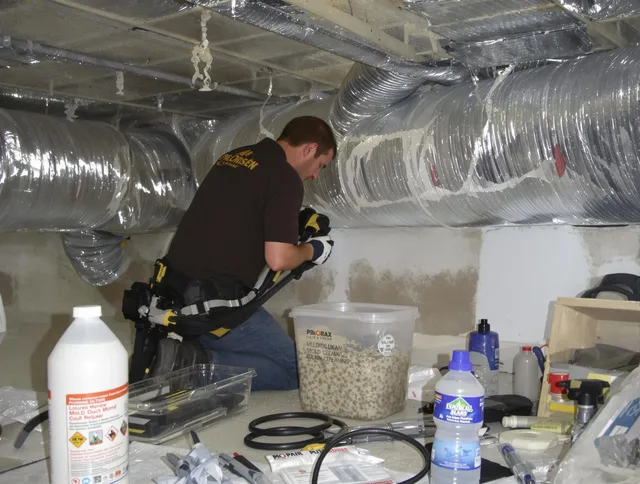 Lynnfield Air Duct Cleaning specialist performing professional mold removal from air ducts in Lynnfield