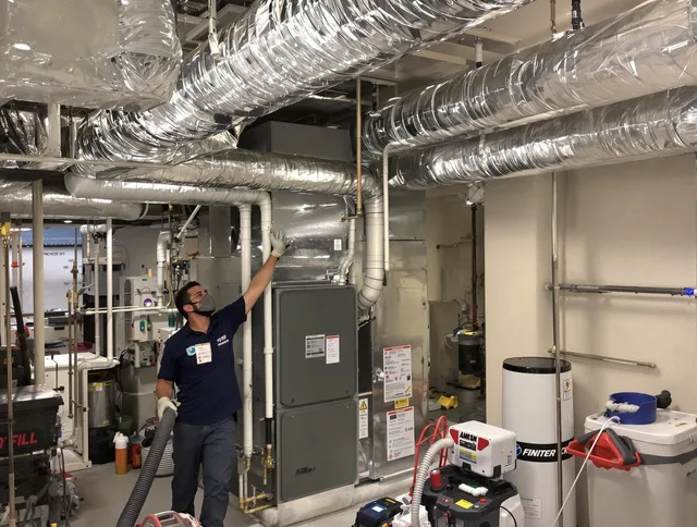 Lynnfield Air Duct Cleaning specialist performing thorough furnace duct cleaning in a Lynnfield residence