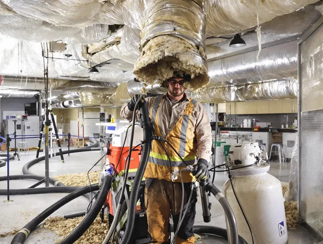 Professional vacuum insulation removal by Lynnfield Air Duct Cleaning expert in Lynnfield